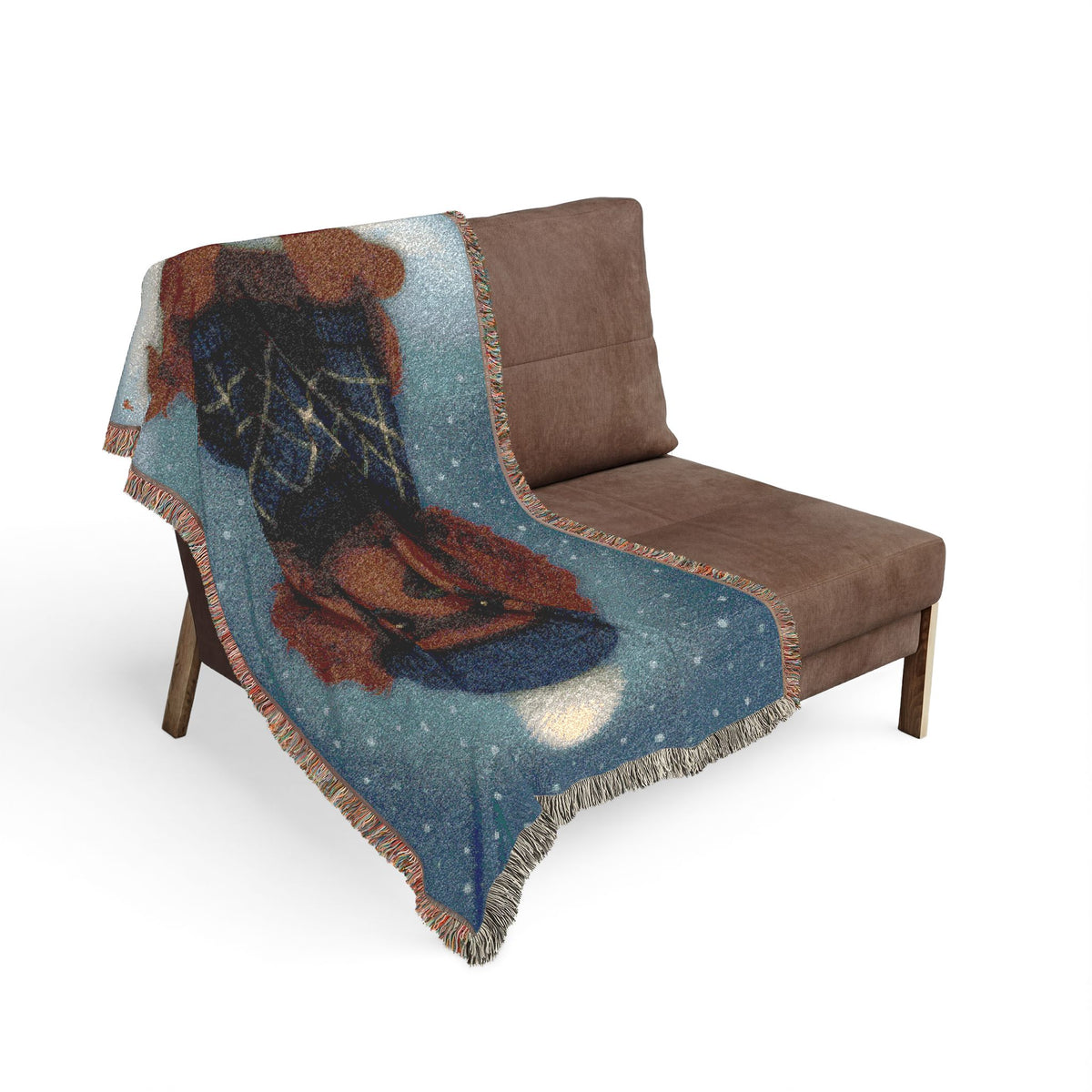 Ruby Cavalier woven cotton blanket draped over a brown armchair in a living room