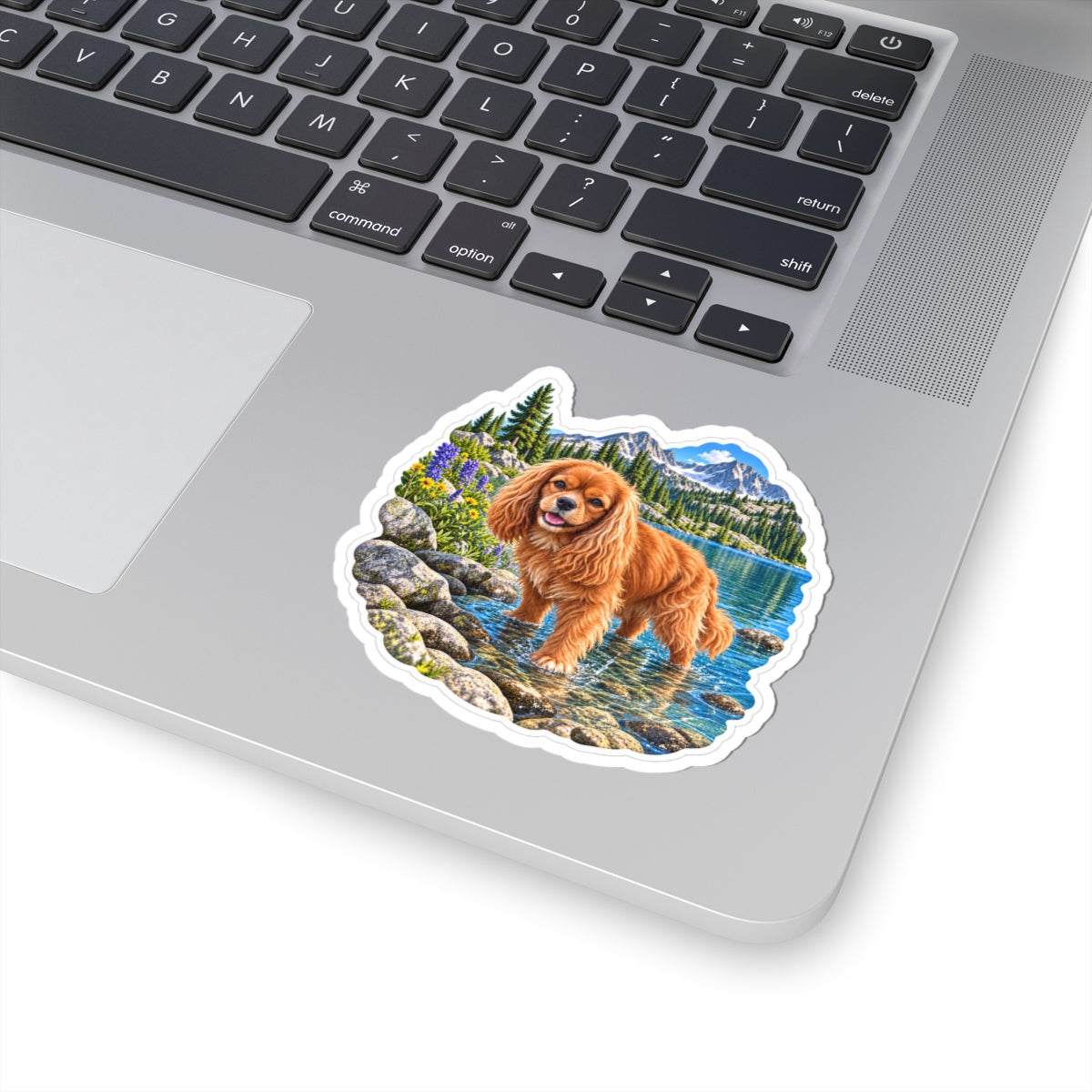 Cavy Snuggle Club alpine lake sticker featuring Willow, a ruby Cavalier King Charles Spaniel, shown in a product mockup.