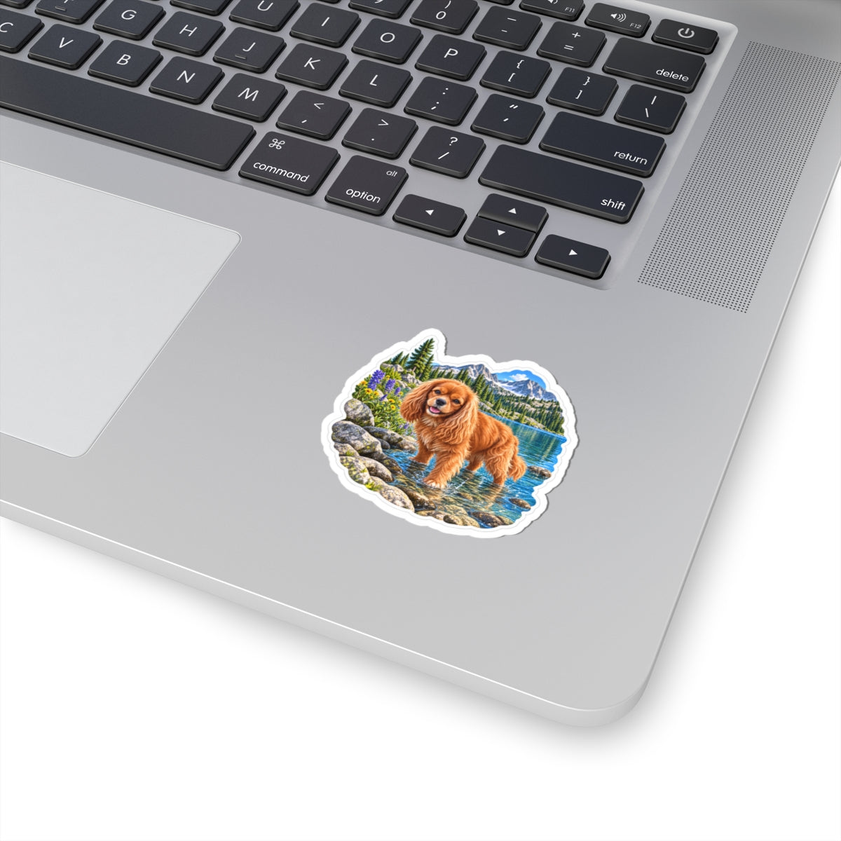 Cavy Snuggle Club alpine lake sticker featuring Willow, a ruby Cavalier King Charles Spaniel, shown in a product mockup.