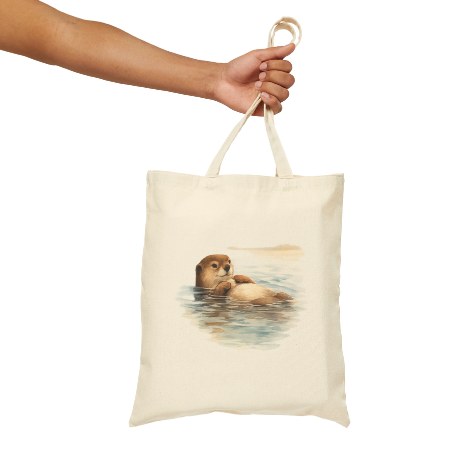 Sea otter floating at rest on a natural cotton canvas tote