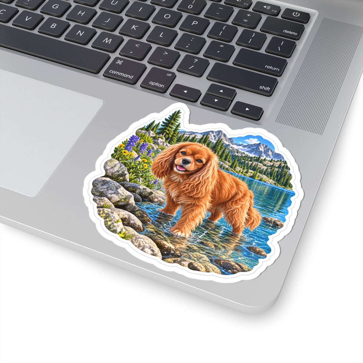 Cavy Snuggle Club alpine lake sticker featuring Willow, a ruby Cavalier King Charles Spaniel, shown in a product mockup.